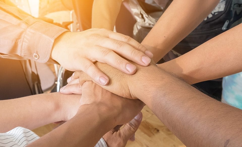 hands in a huddle