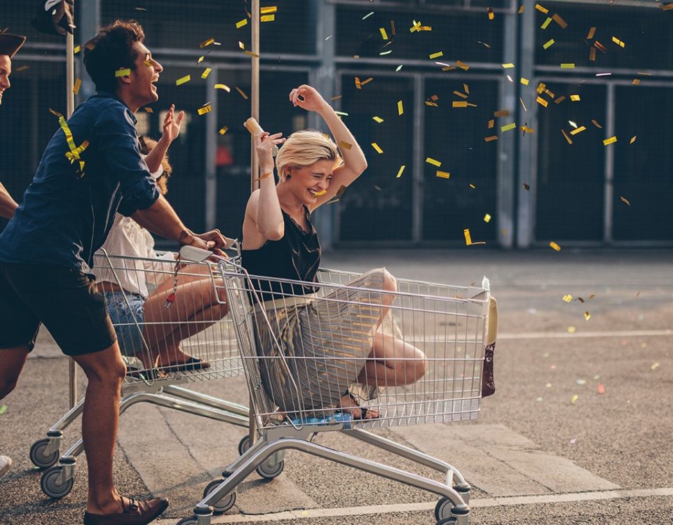 people riding shopping carts