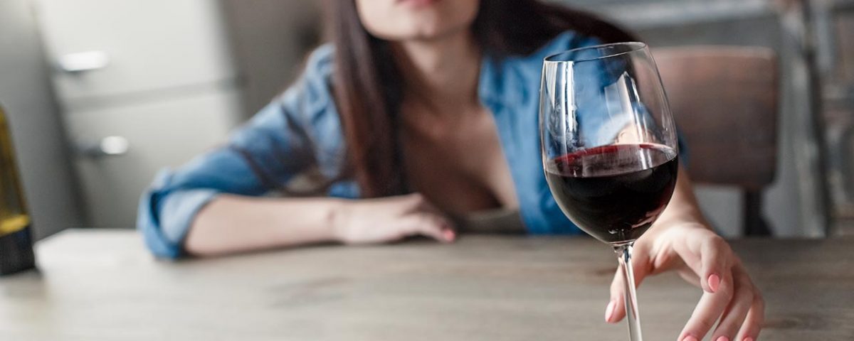 woman with glass of wine