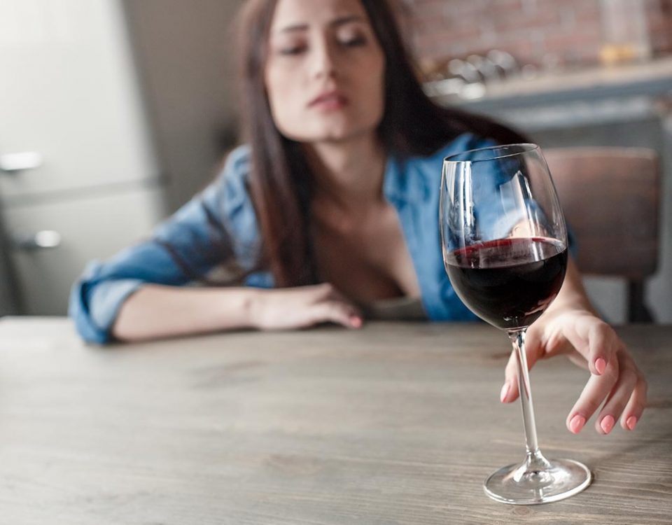 woman with glass of wine