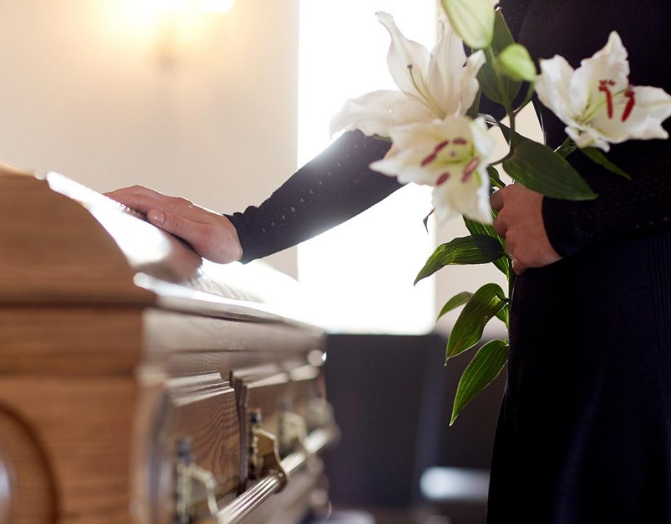 man at casket