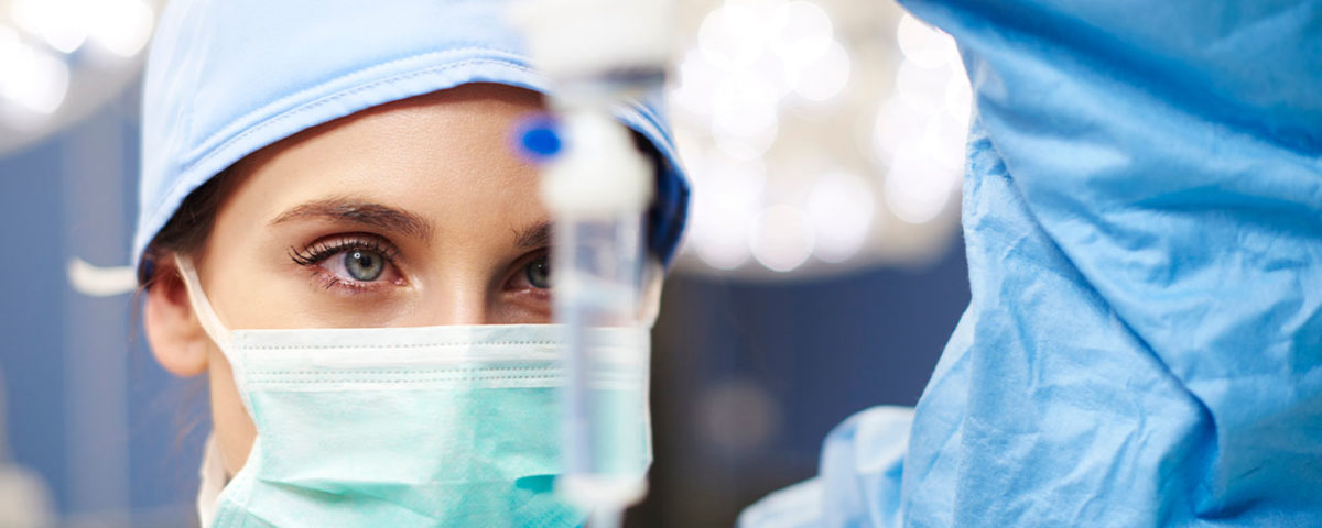 Doctor looking at drug