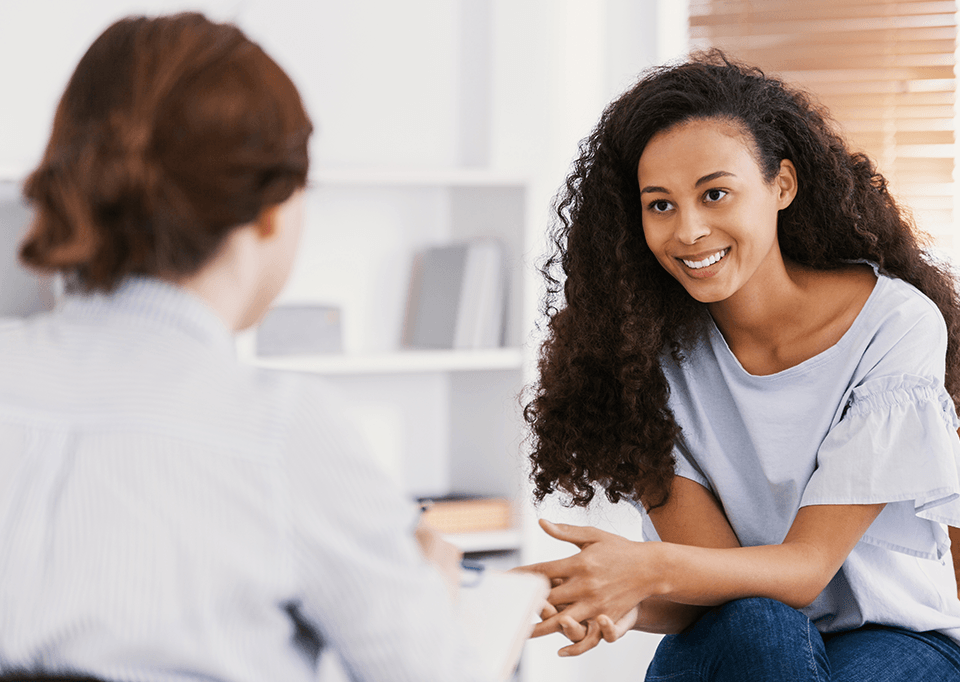 two women talking in a therapy session