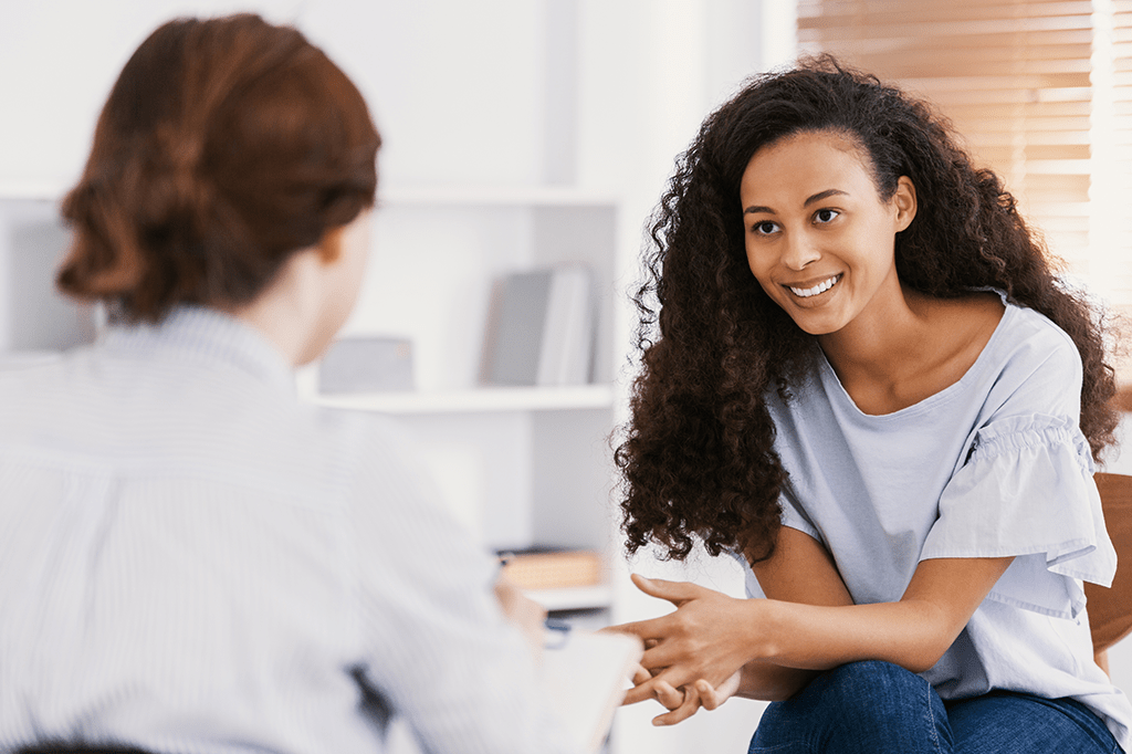 two women talking in a therapy session